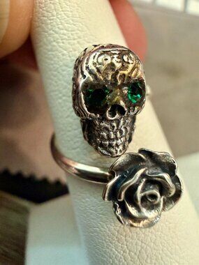 Dainty rose skull ring, sterling silver with green gemstone eyes.